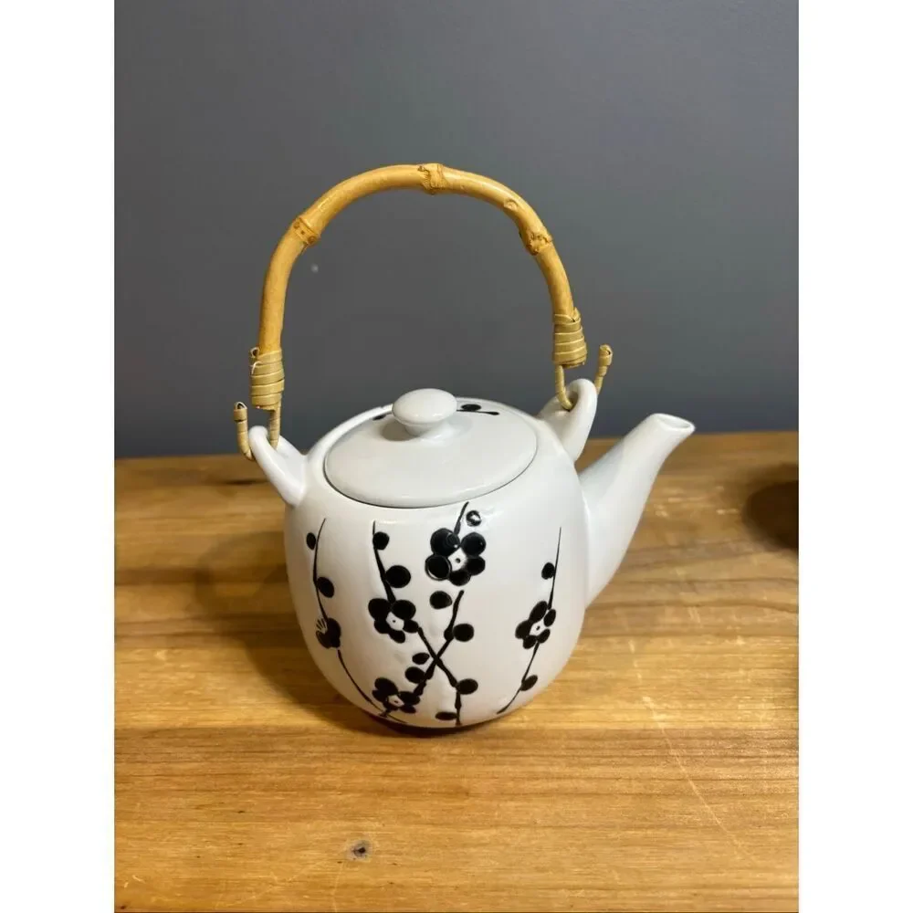 White ceramic tea pot and 4 tea cups with black cherry blossoms